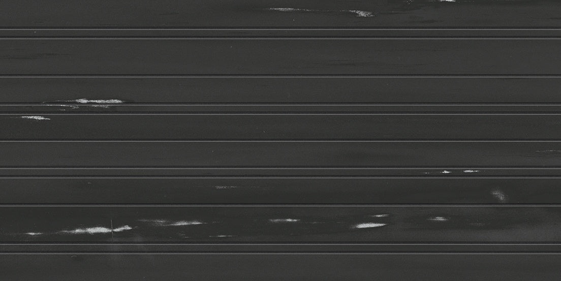 Matte black porcelain wall tile with delicate dolomite-inspired veins, exuding timeless elegance and refined sophistication.