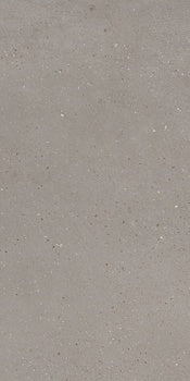 Rectified matte porcelain tile in soft silver-gray, evoking sedimentary rock with a sleek, minimalist industrial elegance.