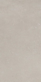 Sleek matte white porcelain tile with a soft sandy texture, evoking serene coastal stone in minimalist luxury.