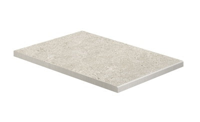 A textured matte porcelain border in soft white, evoking natural stone with rustic elegance for refined outdoor spaces.