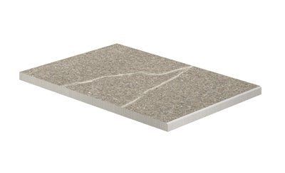 L-shaped matte porcelain border in warm greige limestone texture, evoking rustic Italian piasentina stone for refined outdoor transitions.