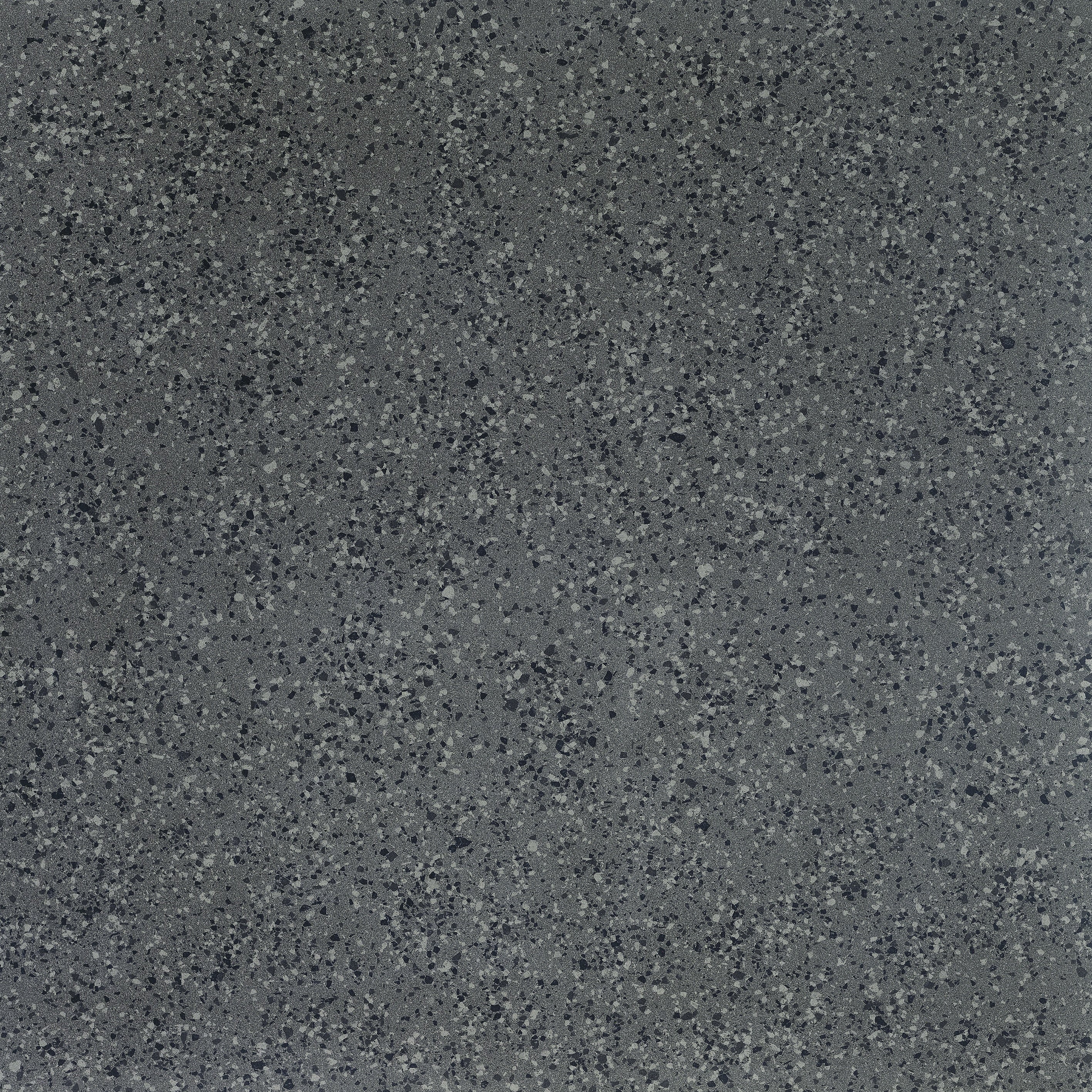 Dark grey porcelain tile with a medium-grain terrazzo look, matte bush-hammered texture, and timeless industrial elegance.