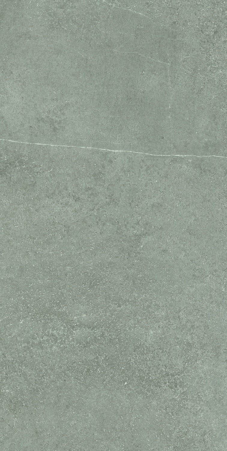 Matte gray porcelain tile with a softly textured concrete finish and refined rectified edges, exuding modern industrial elegance.
