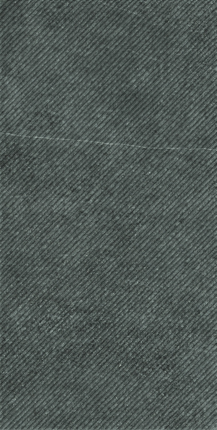 Matte dark gray porcelain wall tile with refined diagonal grooves, exuding contemporary elegance and tactile sophistication.