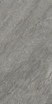 Dark gray porcelain tile with a matte quartzite texture, exuding primordial depth and serene luxury for intimate, harmonious spaces.