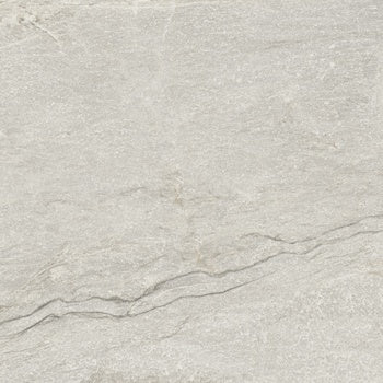 A warm beige quartzite-look porcelain tile with a matte, slip-resistant finish, evoking primordial serenity and natural depth.