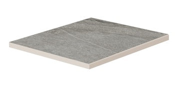 Matte dark gray quartzite-look porcelain border tile with polished edges, evoking primordial serenity for refined outdoor and indoor spaces.