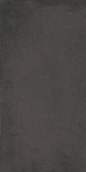 Matte black porcelain tile with a handcrafted oxidized finish, evoking timeless Tuscan elegance and earthy warmth.