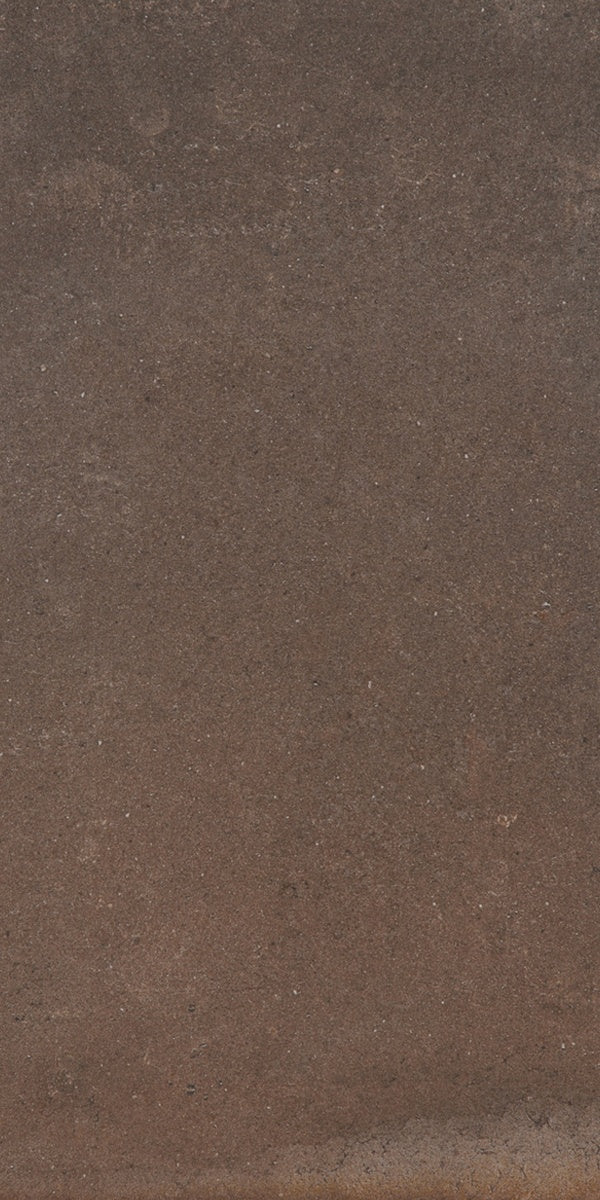 Dark brown porcelain tile with warm terracotta undertones, matte textured surface, and handcrafted oxidized charm for timeless elegance.