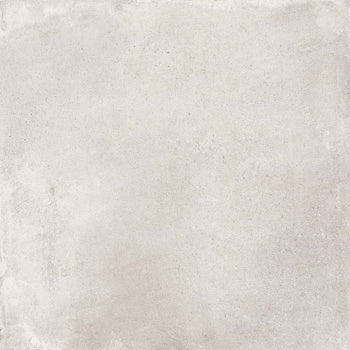 Large-format matte white porcelain tile with warm earthy tones and handcrafted charm, evoking timeless Tuscan elegance.