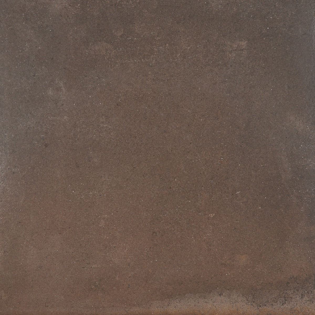 Earthy dark brown porcelain tile with a warm terracotta-inspired matte finish, evoking handcrafted Tuscan elegance.