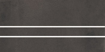 Matte black porcelain tile with warm oxidized edges, evoking handcrafted terracotta charm in a refined contemporary finish.