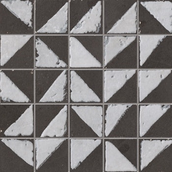 Matte black porcelain tile with a warm, handcrafted charm, evoking timeless elegance and earthy sophistication in a refined contemporary space.