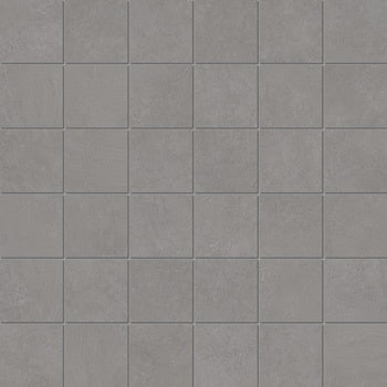 Matte gray porcelain mosaic tiles with a soft plaster-like texture, offering minimalist elegance and serene warmth for refined interiors.