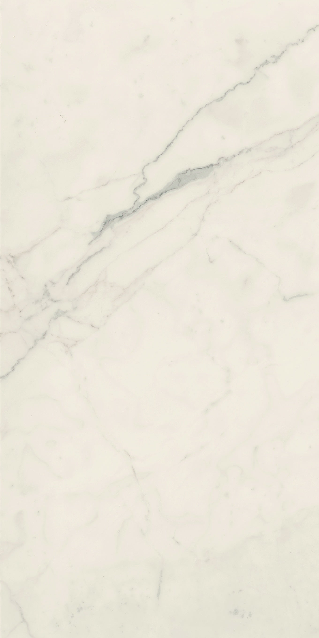 Elegant white porcelain tile with soft marble veining and a refined matte finish, exuding timeless luxury for sophisticated interiors.