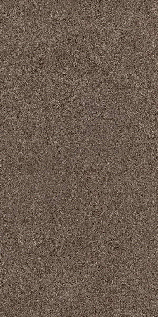 Minimalist dove grey porcelain tile with a soft matte resin texture, evoking urban sophistication and fluid dynamism for modern interiors.