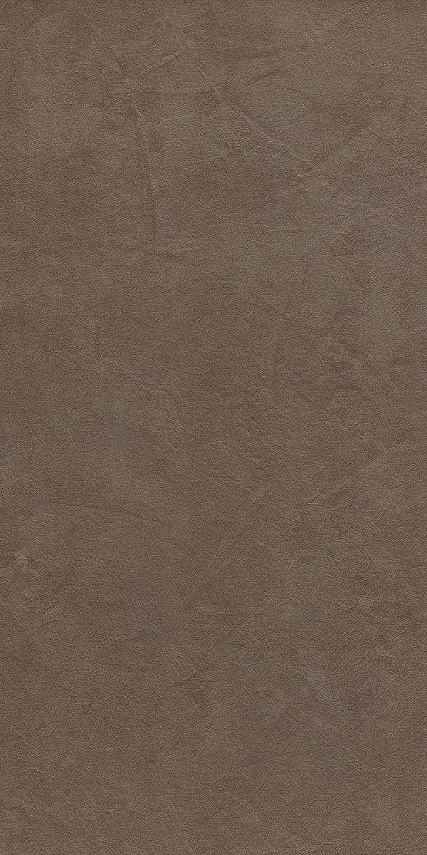 Minimalist dove grey porcelain tile with a soft matte resin texture, evoking urban sophistication and fluid dynamism for modern interiors.