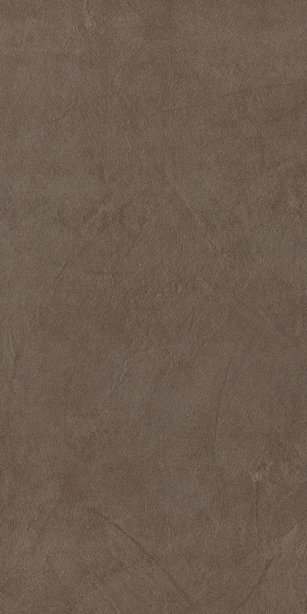 Minimalist dove grey porcelain tile with a soft matte resin texture, evoking urban sophistication and fluid dynamism for modern interiors.
