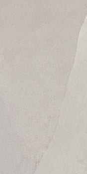 A softly textured porcelain tile with delicate slate-like ripples and subtle furrows in a serene matte white, evoking weathered stone.