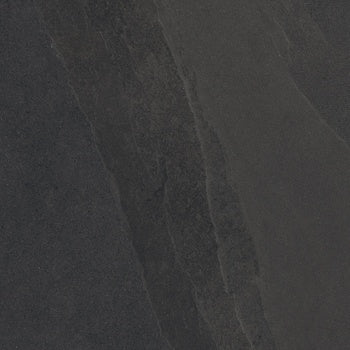 Black porcelain tile with a softly textured slate surface, evoking weathered stone and organic ripples for a serene yet dramatic statement.