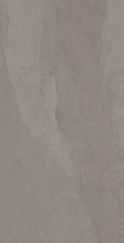 Slate-gray porcelain tile with soft ripples and weathered furrows, evoking the raw elegance of a stone forest. Matte, bush-hammered texture for serene, grounded luxury.