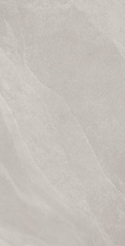 Soft, weathered slate-effect porcelain tile with subtle ripples and furrows in a serene white, evoking ethereal stone forest textures.