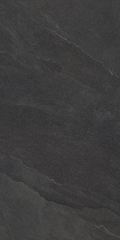Black porcelain tile with a softly textured slate surface, evoking weathered stone and organic ripples for a serene, timeless elegance.