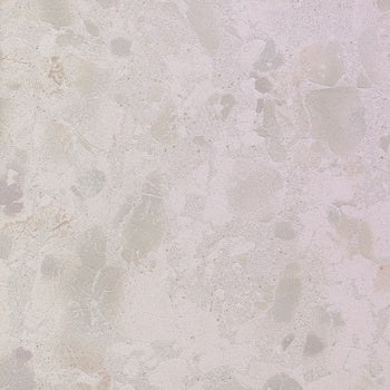White terrazzo-effect porcelain tile with raw material chips and unpredictable texture, matte 3D surface, rectified edges, industrial elegance.