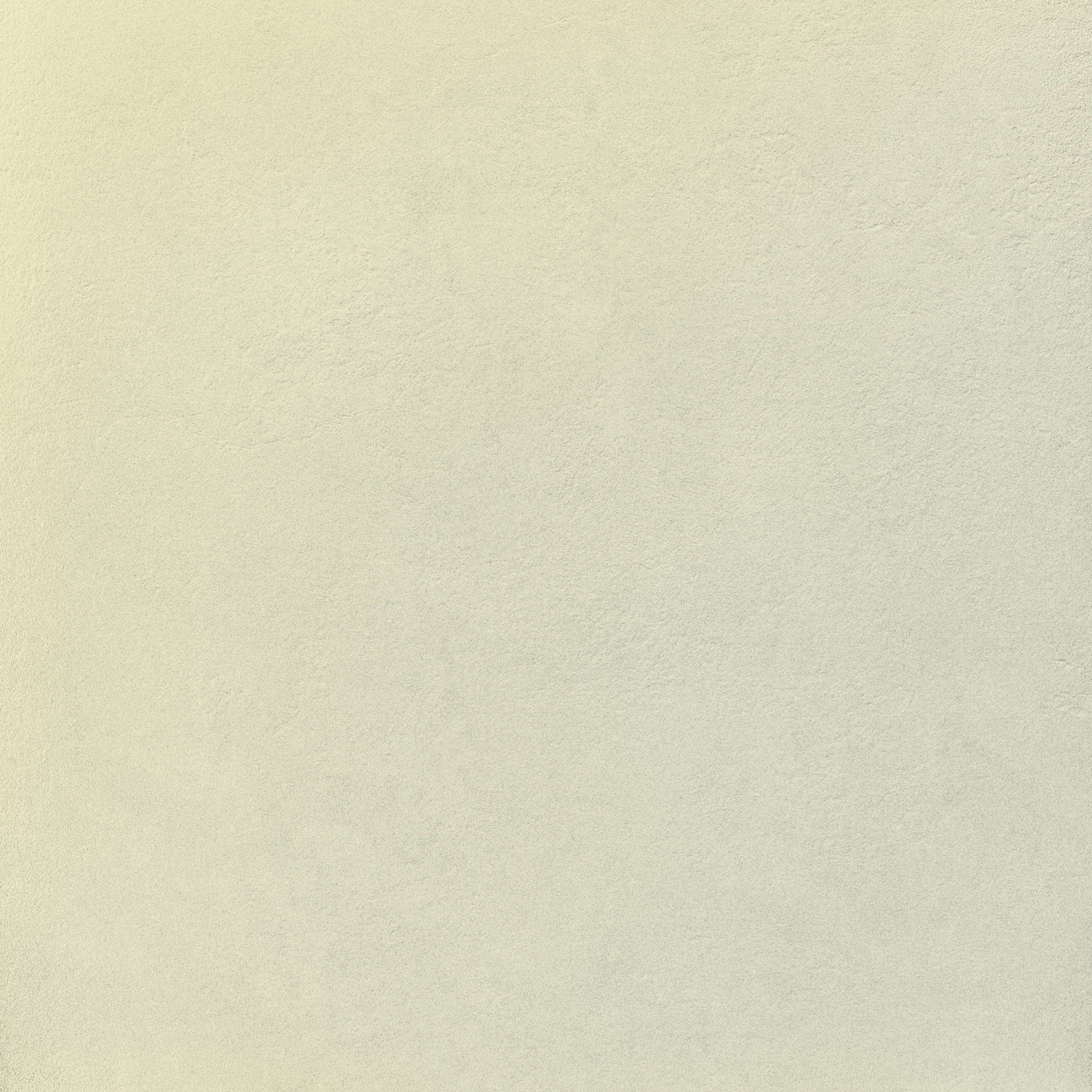 A large-format square porcelain tile with raw, textured concrete finish in matte white, exuding industrial elegance and minimalist strength.