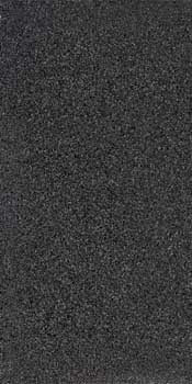 Black terrazzo porcelain tile with concrete-inspired matte finish and subtle chips, exuding timeless elegance and bold modernity.
