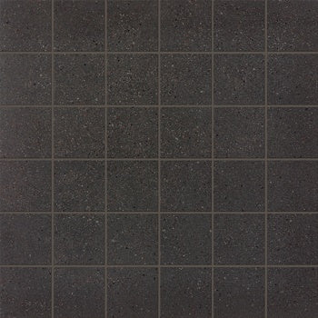 Industrial-chic dark gray porcelain mosaic with subtle multicolored grains and a matte concrete finish for timeless urban elegance.