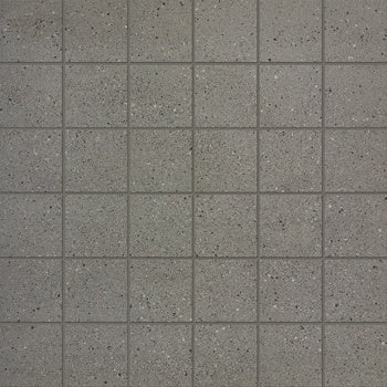 Industrial-chic porcelain mosaic with matte gray concrete texture, subtle multicolored grains, and raw urban elegance for timeless interiors.