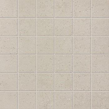 Industrial-chic white porcelain mosaic with subtle multicolored grains and a matte concrete finish, exuding raw elegance and timeless urban sophistication.