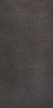 Industrial-chic porcelain tile in dark grey with subtle multicolored grains and glossy finish, embodying raw elegance and urban durability.