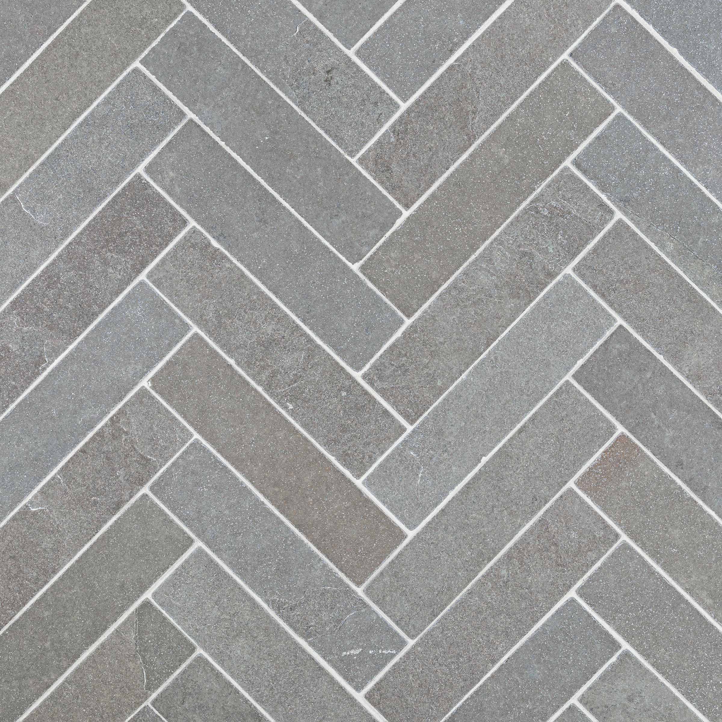 purebeck grey limestone brick herringbone bush hammered distressed grey 2x8x3_8 installed herringbone surface group natural stone resource