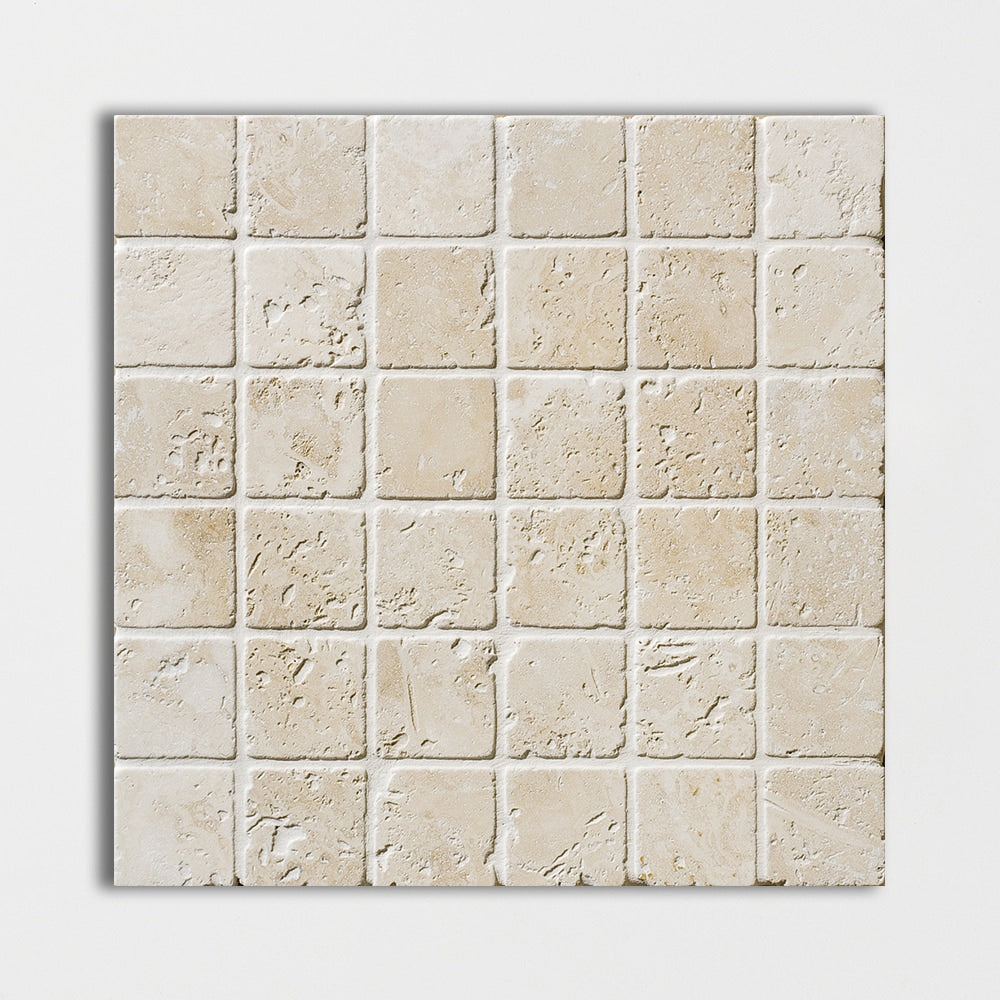 ivory travertine straight edge joint 2 by 2 inch square shape natural stone mosaic sheet tumbled finish 12 by 12 by 3 of 8 tumbled finish for interior and exterior applications in shower kitchen bathroom backsplash floor and wall produced by marble systems and distributed by surface group international