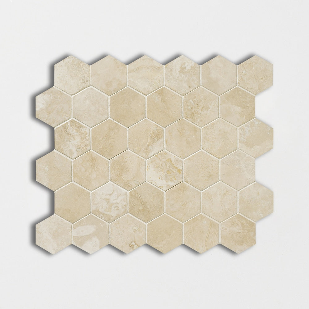 ivory travertine hexagon shape shape natural stone mosaic sheet honed finish patika filled 10 and 3 of 8 by 12 by 3 of 8 straight edge for interior and exterior applications in shower kitchen bathroom backsplash floor and wall produced by marble systems and distributed by surface group international