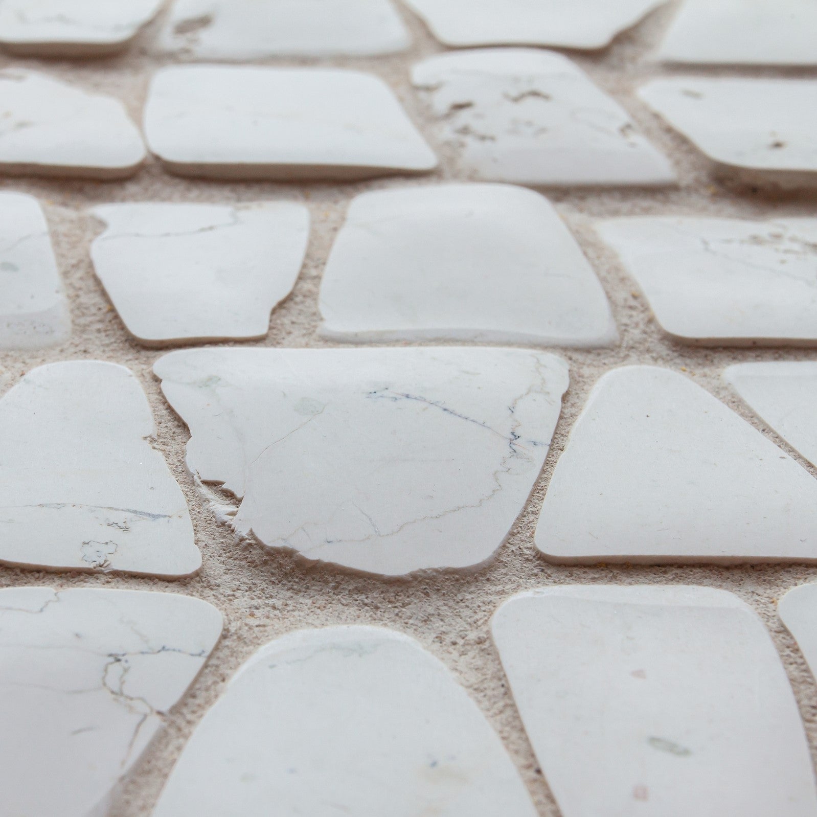giovanni barbieri timeworn bianco antico natural white marble irregular handcut pattern mosaic distributed by surface group international