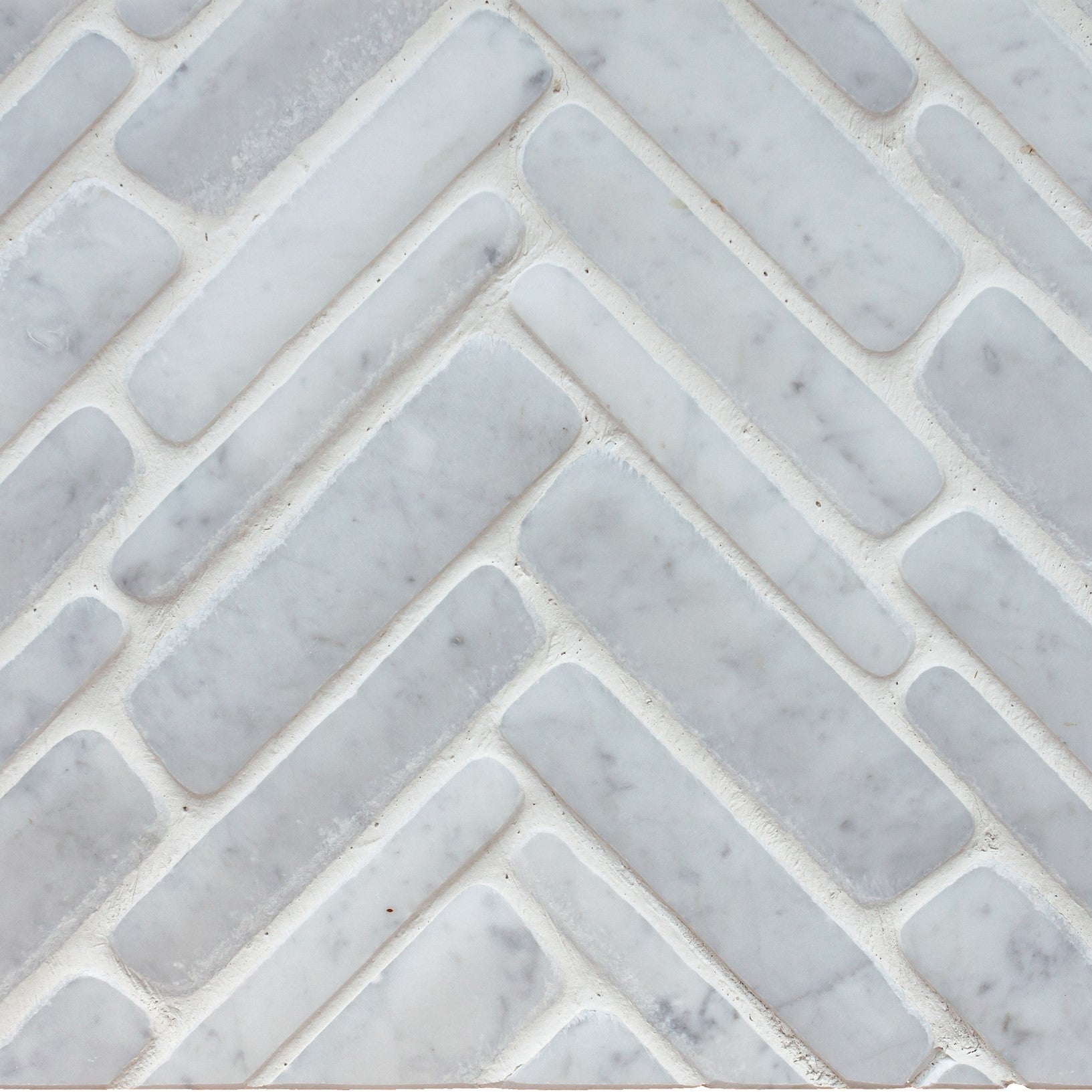 giovanni barbieri timeworn carrara natural white marble herringbone pattern mosaic distributed by surface group international