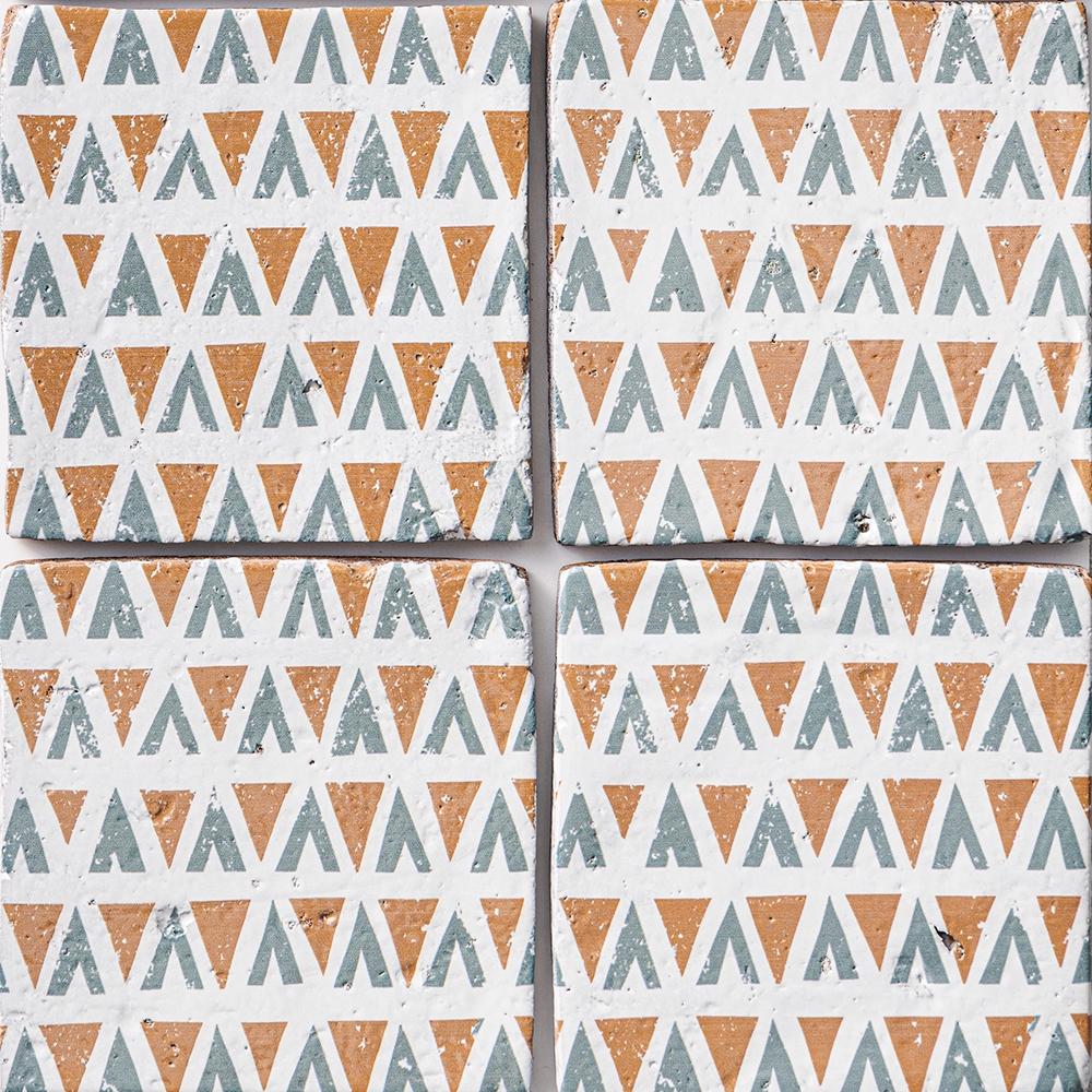 zuni 2 antique glazed terracotta deco tile size six by six sold by surface group manufactured by marble systems used for kitchen backsplashes living room accent walls and bathroom walls
